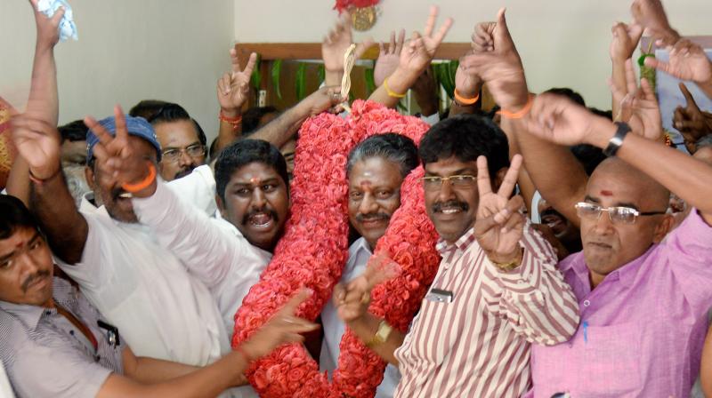 Tamil Nadu Chief Minister O Panneerselvam being greeted by his supporters at his residence in Chennai. (Photo: PTI)