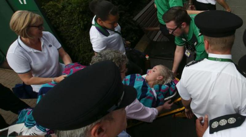 Bethanie Mattek-Sands beign carried on stretcher after suffering knee injury (Photo: AFP)