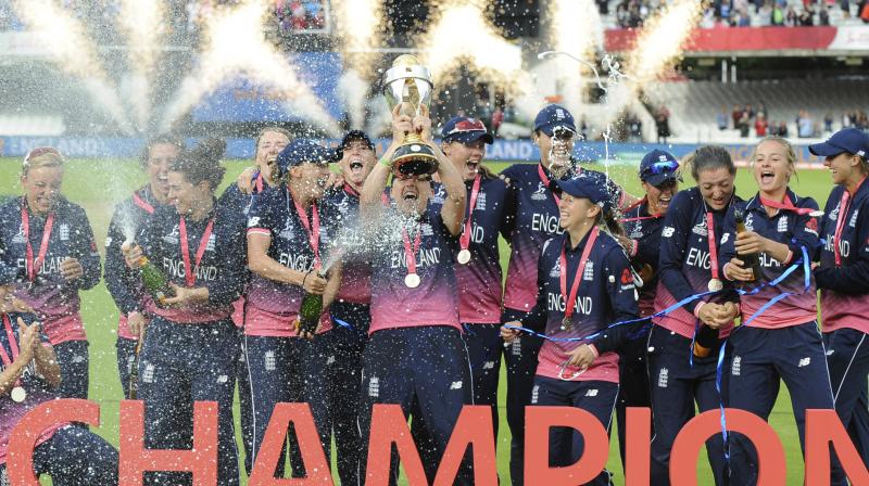 The victorious England team after winning the World Cup trophy. (Photo: AP)