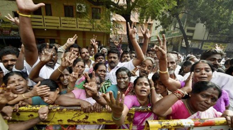 Supporters of Tamil Nadu Chief Minister Jayalalithaa cry in front of Apollo hospital after Jayalalithaa suffered a cardiac arrest, in Chennai on Monday.