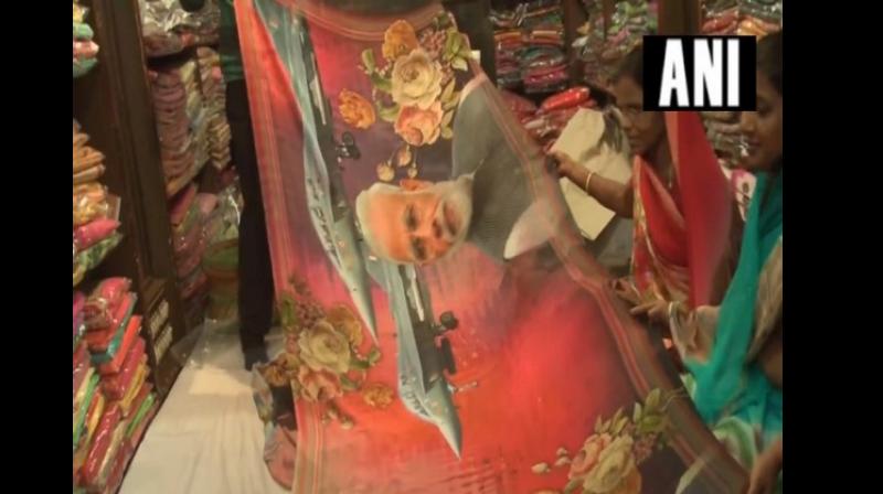A number of women are bringing other women along with them to buy the sarees. (Photo: ANI)