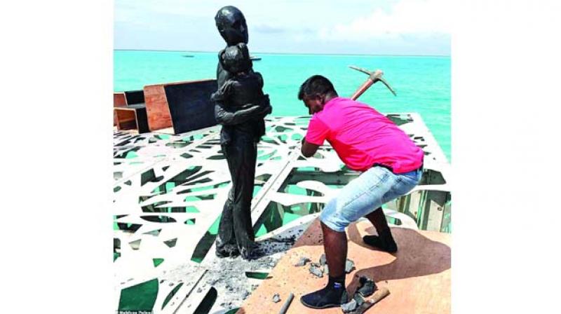 Jason deCaires Taylors sculpture being destroyed with pickaxe after outgoing Maldives president Abdulla Yameen ruled it was offensive to Islam.