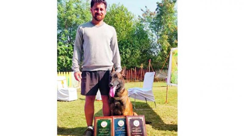 Trainer Mantravadi Chandra Shekhar with his pet Yodha, who got certified in the Protection Sports Association.