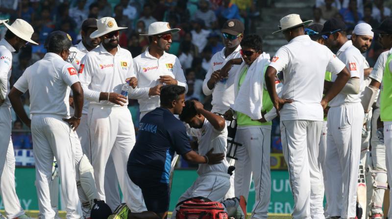 When Murali Vijay tried to pull a short delivery on the first day of the third and final Test, it hit Sadeera Samarawickrama flush on crest of his helmet. He was immediately taken off the field and sent to the hospital for precautionary scans. (Photo: BCCI)