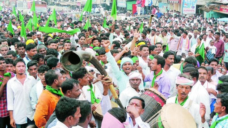 Adivasis stage a protest in Asifabad on Thursday. (Photo: DC)