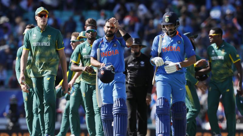 Virat Kohli and Yuvraj Singh make their way back to the dressing room after guiding their side to a victory against South Africa, at The Oval. (Photo: AP)
