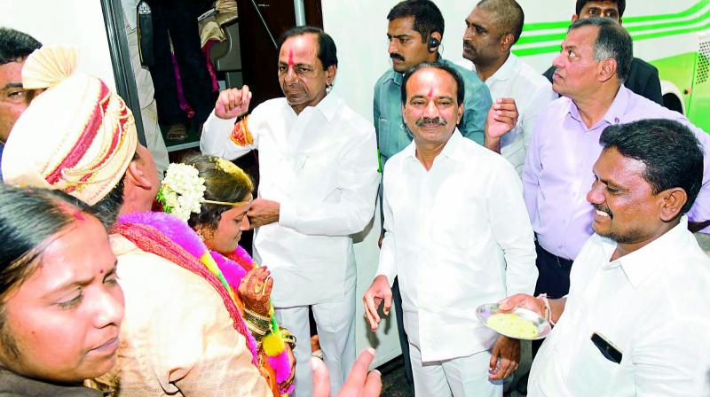 Chief Minister K. Chandrasekhar Rao blesses the newly-wedded couple of Kavya and Manohar at Thadikal Shankarpattanam mandal in Karimnagar district on Thursday. 	(Photo: DECCAN CHRONICLE)