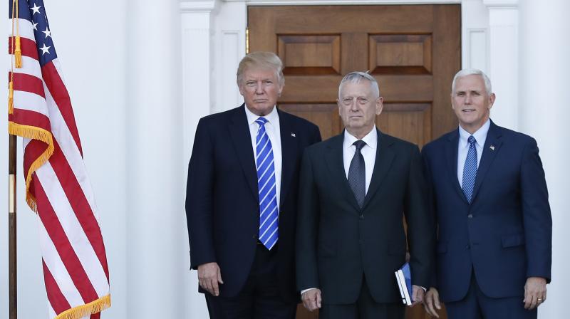 US President-elect Donald Trump and Vice President-elect Mike Pence with retired Marine Corps General James Mattis at Trump National Golf Club Bedminster clubhouse in Bedminster, New Jersey on Saturday. (Photo: AP)
