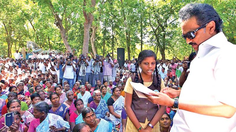 DMK working president M.K. Stalin on Monday interacts with a school student regarding Kathiramangalam oil well row. (Photo: DC)