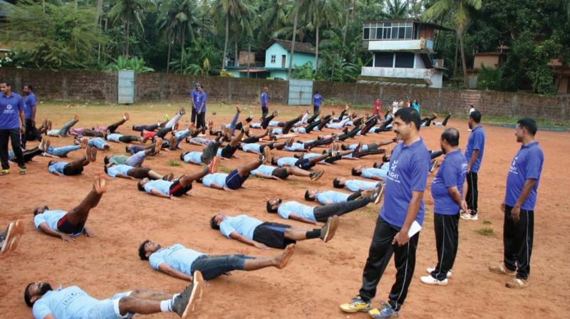 Students undergo physical training lessons at Panoor government higher secondary school ground in Panoor.