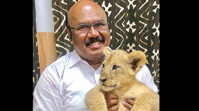 D. Jayakumar with little lion cub