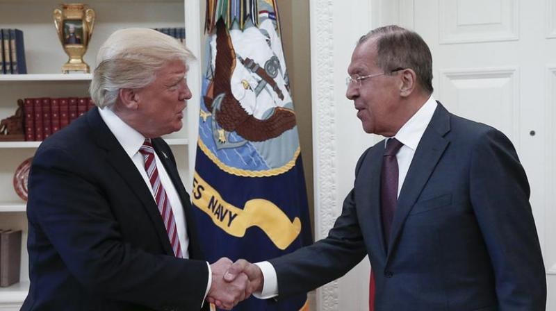 US President Donald Trump (L) shakes hands with Russian foreign minister Sergei Lavrov during their meeting at the White House in Washington, DC.(Photo: AFP)