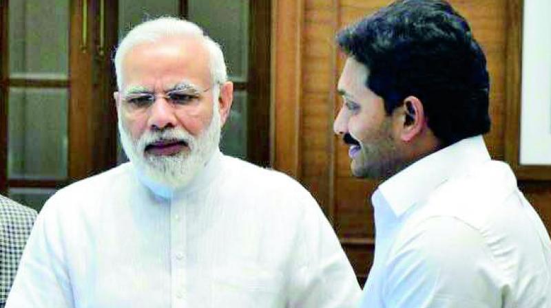 YSRC president Y.S. Jagan Mohan Reddy submits a memo to Prime Minister Narendra Modi.