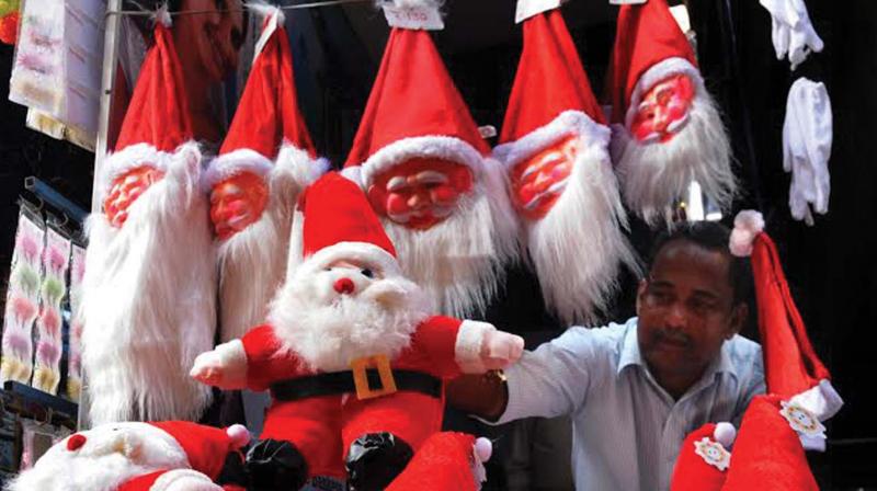 Santas on display at a shop on Broadway in Kochi welcoming Xmas season. (Photo: DC)
