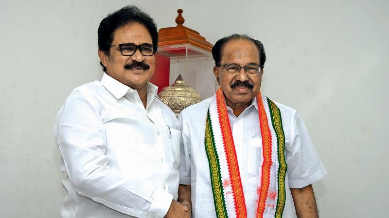 TNCC president Su Thirunavakarasar greets senior Congress leader Veerappa Moily in Chennai. (Photo: DC)