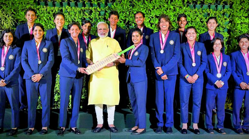 Prime Minister Narendra Modi poses for a group photograph with the Indian womens cricket team in New Delhi on Thursday. (Photo: AP)