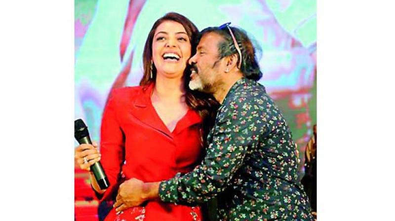 Kajal Agarwal and cinematographer Chota on stage at the film function.