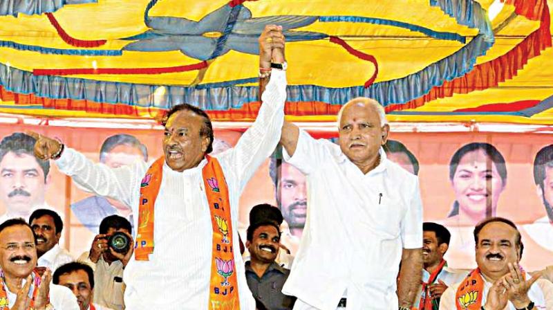 State BJP chief B.S. Yeddyurappa and party leader K.S. Eshwarappa at a rally of Backward Classes in Tumakuru on Thursday 	 DC