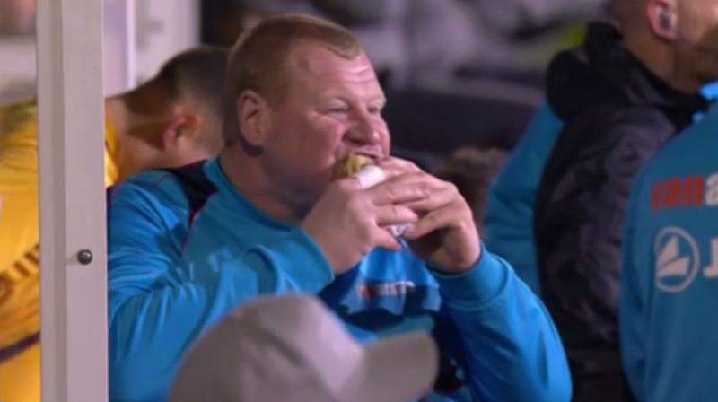 Wayne Shaw munched on a pie while sitting on the bench in an FA Cup match against Arsenal. The footage of Shaw eating was broadcast on the BBC. (Photo: Screengrab)