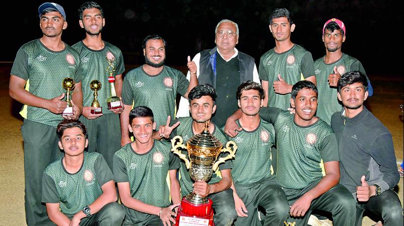 The Hyderabad team pose with the trophy after finishing runners-up in the All India U-19 Twenty20 cricket championship at the Lal Bahadur Stadium in Hyderabad on Sunday.	 (DC)