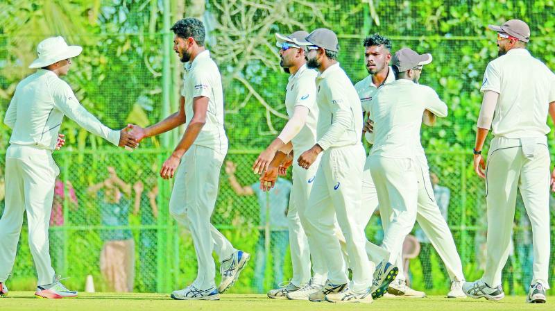 Kerala players celebrate a Gujarat wicket during the quarterfinal at Wayanad.  (PTI)