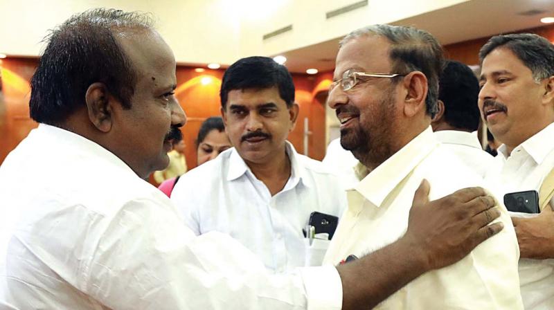 Deputy mayor T.J. Vinod greets Opposition leader K.J. Antony after presenting the Kochi corporations budget for 2019-20 on Saturday.  (ARUN CHANDRABOSE)