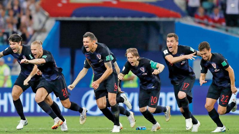 Croatian players celebrate their victory over Russia.