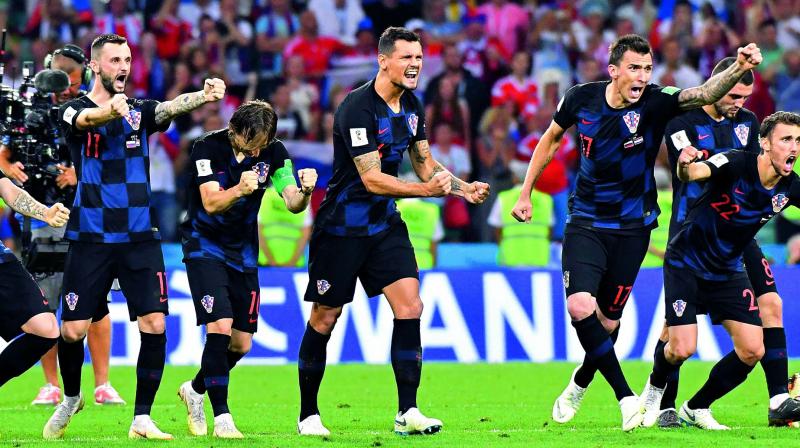 Croatian players celebrate a strike during the penalty shootout against Russia in the quarterfinal at the Fisht Stadium in Sochi on Saturday night. (Photo: AFP)