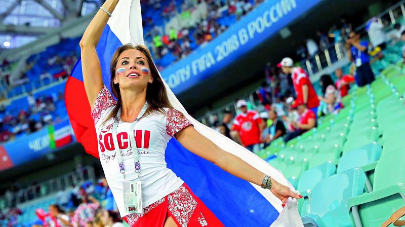 A Russian fan cheers during the match against Croatia at the Fisht Stadium in Sochi on Saturday. (Photo: AP)