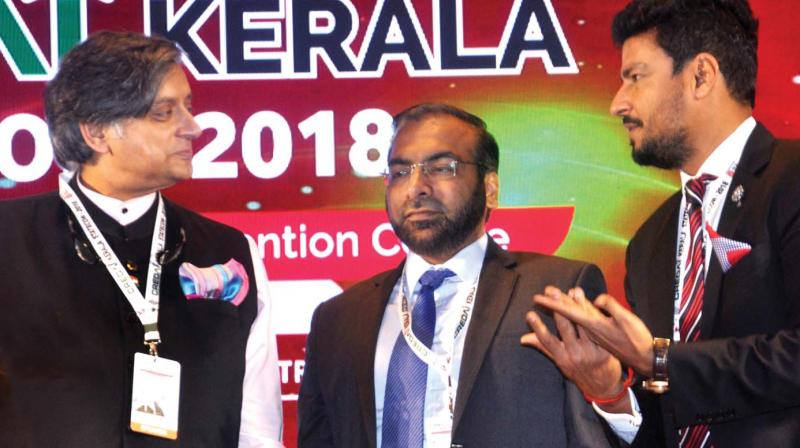 Member of Parliament Shashi Tharoor, Credai Kerala chairman Najeeb Zackeria, and national president Jaxay Shah at the state conference of Credai Kerala in Kochi on Friday. (Photo: Sunoj ninan mathew)