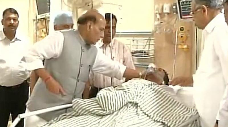 Home Minister Rajnath Singh and Chhattisgarh CM Raman Singh meet injured CRPF personnel, at Ramkrishna Care Hospital on Tuesday. (Photo: ANI Twitter)