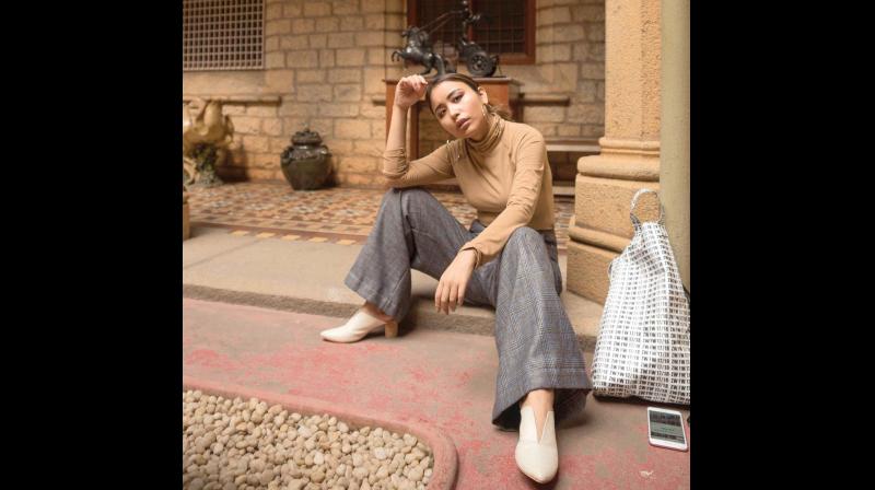 Sonia Thiyam, a fashion blogger wearing checked pants, which was a top trend in 2017