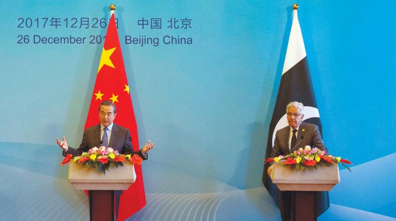 Chinese foreign minister Wang Yi flanked by his Pak counterpart Khawaja Asif at the 1st China-Afghanistan-Pakistan Foreign Ministers meet.