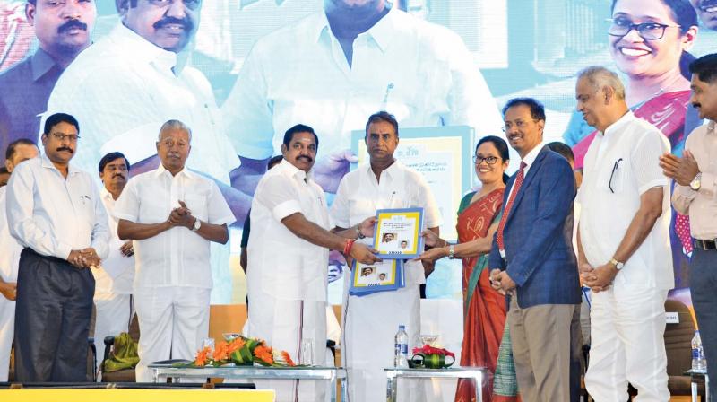 Chief Minister Edappadi K. Palaniswami receives the MoU from S. Malarvizhi, chairperson and managing trustee of Sri Krishna Institutions and trustee of Uyir after he formally launched the  initiative in the cotton city on Saturday.