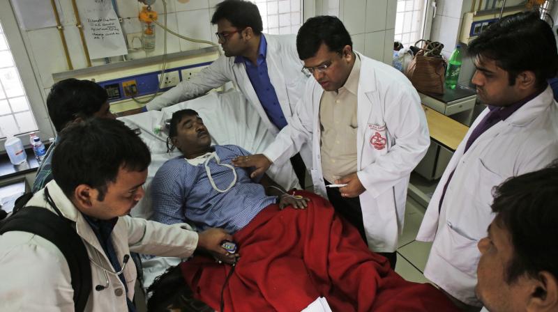 An injured passenger is treated at a hospital in Kanpur, Uttar Pradesh, on Monday. (Photo: AP)