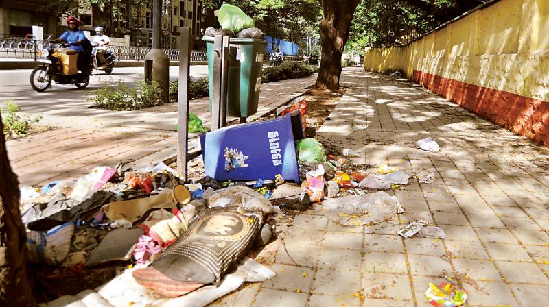 Garbage overflowing from bins placed on footpath along Richmond Road near DIG office (Internal Security).