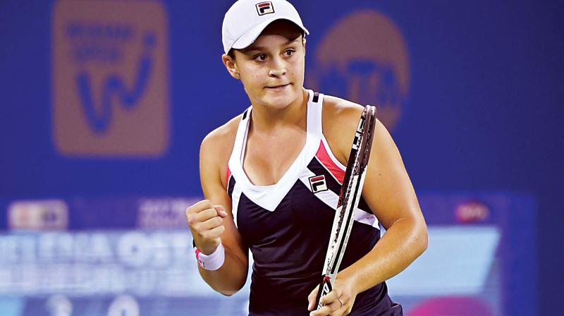 Ashleigh Barty celebrates after defeating Jelena Ostapenko in their womens singles semi-finals match at the WTA Wuhan Open.  (Photo: AFP)