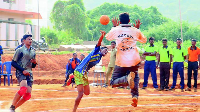 Players in action at the Inter University Handball Tourney being held at Vikas College of Physcial  Education College in Nunna near Vijayawada.