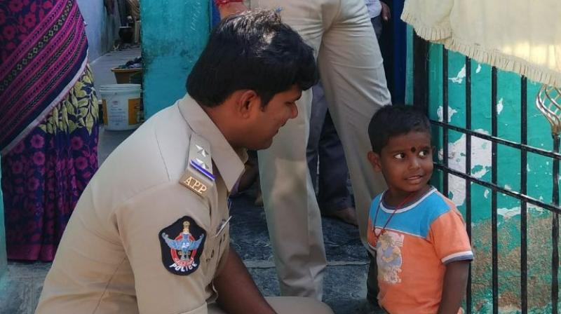 Police officials with the child after the rescue.