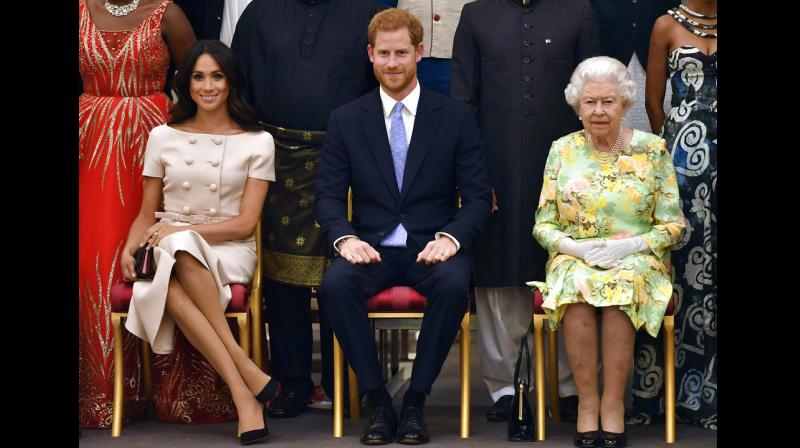 Markle and Prince Harry were accompanying Queen at annual ceremony which champions inspirational young people from across Commonwealth. (Photo: AP)