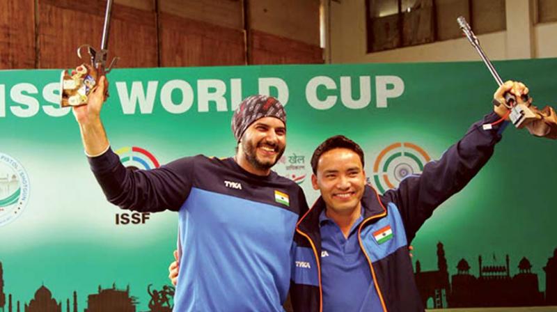 Gold medallist Jitu Rai (right) with second-placed Amanpreet Singh.  (Photo: DC)