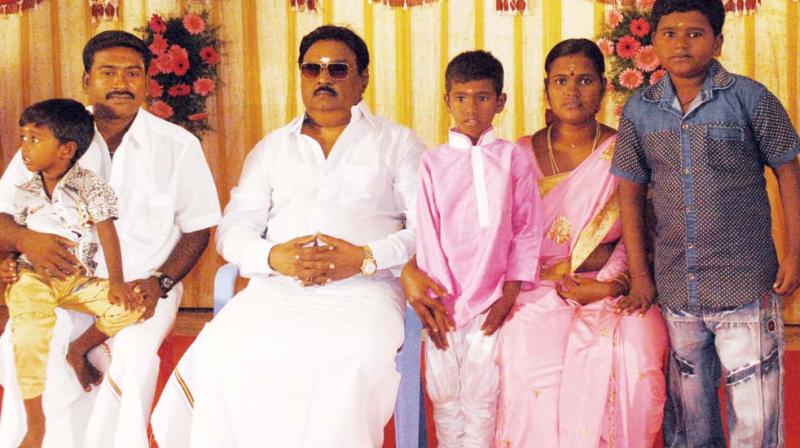 DMDK party chief Vijayakanth poses  morbidly with  supporters at a party function organised at Villupuram district on Wednesday. (Photo: DC)