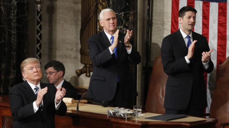 President Donald Trump, Vice President Mike Pence and House Speaker Paul Ryan of Wis. applaud Carryn Owens, widow of widow of Chief Special Warfare Operator William â€œRyanâ€ Owens, on Capitol Hill in Washington, Tuesday, Feb. 28, 2017, during the presidents address to a joint session of Congress. (Photo: AP)