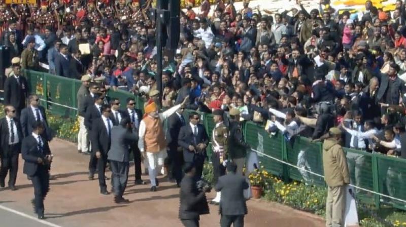 Prime Minister Narendra Modi greets crowds at Republic Day parade in Delhi (Photo: ANI | Twitter)