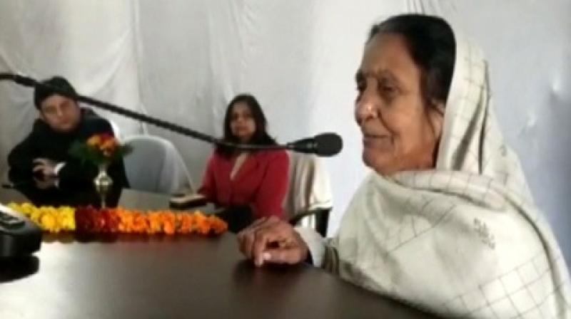 The woman, Rajeshwari Mishra, who has been for the last 40 years, apart of the annual flag hoisting event at the Shahjahapur district collectorate couldnt control her emotions and wept during her address after the flag hosting ceremony. (Photo: ANI)