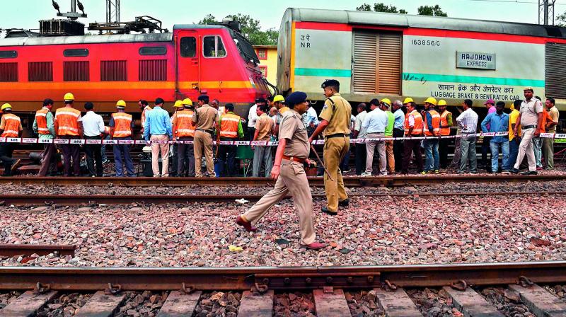 Railway officials at the site where the engine of the Delhi-Ranchi Rajdhani Express train derailed near Minto Bridge in New Delhi on Thursday. (Photo: PTI)
