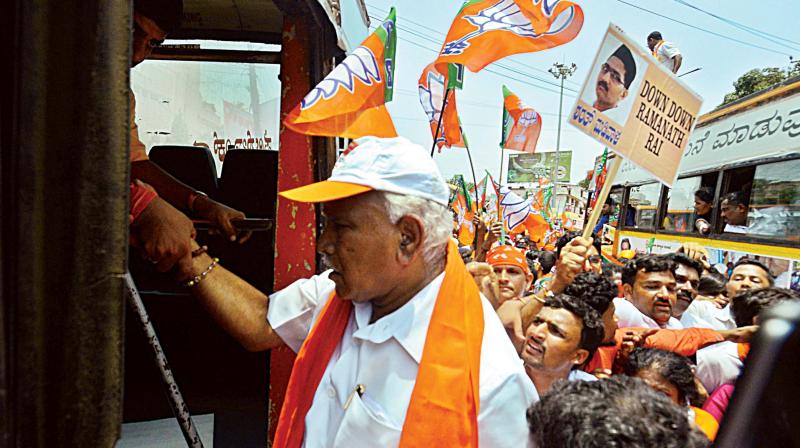 The police detain BJP state president B.S. Yeddyurappa during the Mangaluru Chalo rally in Mangaluru on Thursday. (Photo: KPN)