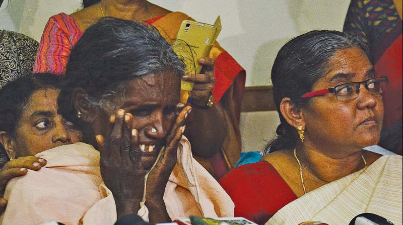 Chinnaponnubreaks down while recounting the beheading of her daughter, at a press meet in city on Friday.    Image: DC