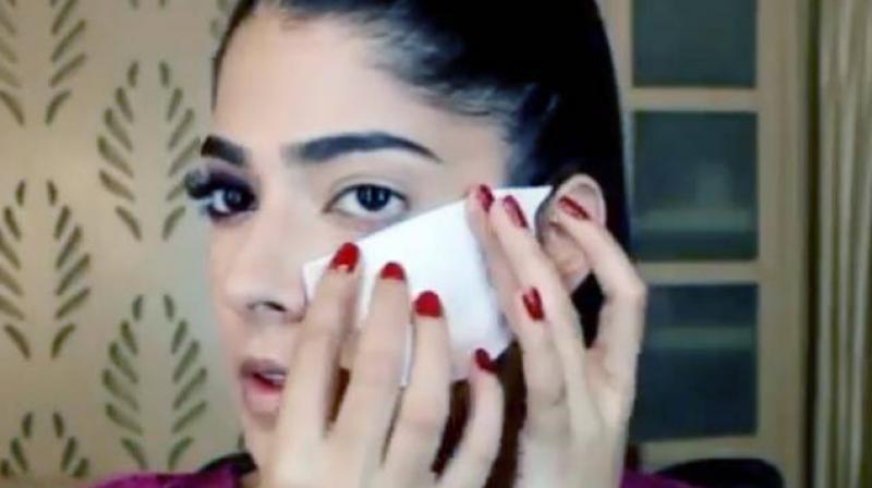 In the tutorial, Geetika Chakravarti is seen pasting an unused sanitary napkin on her cheek as she works with the eyeliner in her other hand. (Photo: Instagram/ @makeupbygeetika)