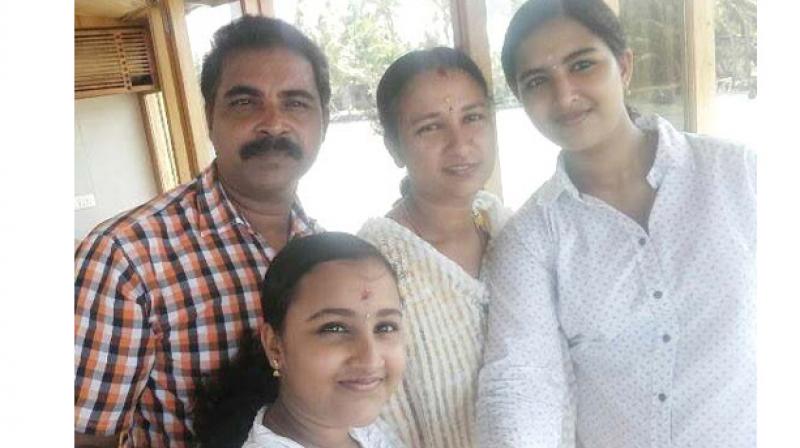 T. Sreeja, with her husband C. P. V. Vinod Kumar and daughters Sreelakshmi,  Meenakshi. (Photo: DC)